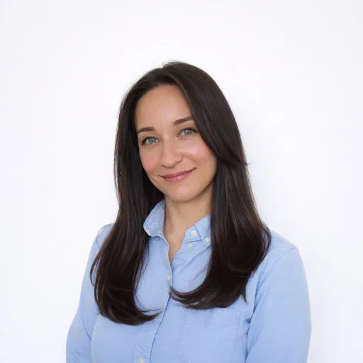Portrait of Alexandra Bihl, smiling, in a light blue shirt